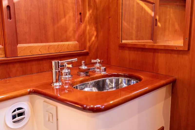 Slide: The Image of Luxurious wooden bathroom interior of 2014 Hinckley Talaria 48 Flybridge yacht. - 48