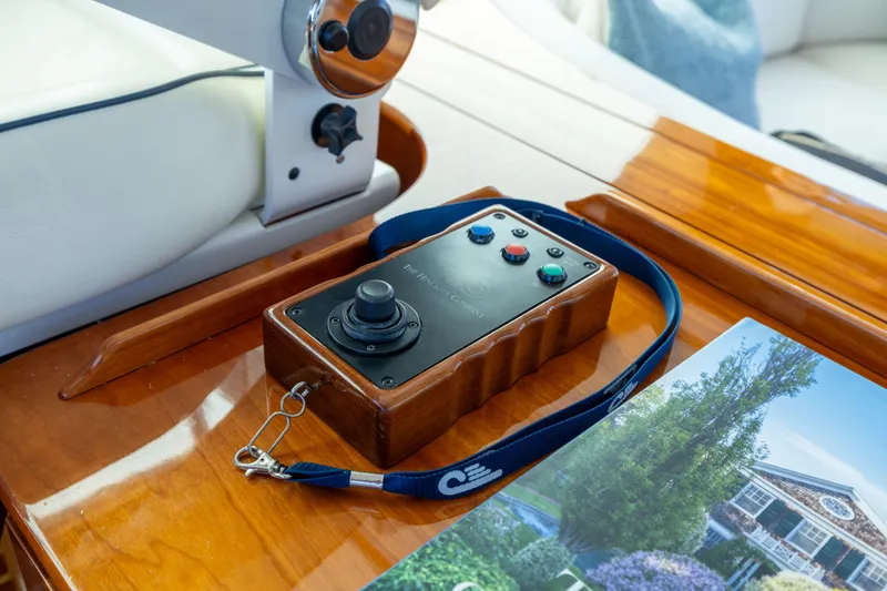 Slide: The Image of Control panel on 2014 Hinckley Talaria 48 Flybridge yacht, featuring joystick and buttons. - 67