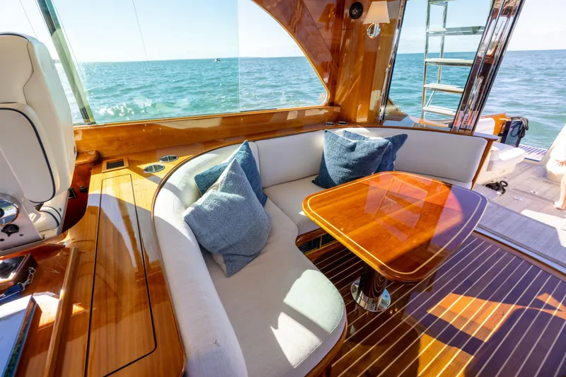 Slide: The Image of Luxurious interior of 2014 Hinckley Talaria 48 Flybridge yacht with elegant wood finish. - 23