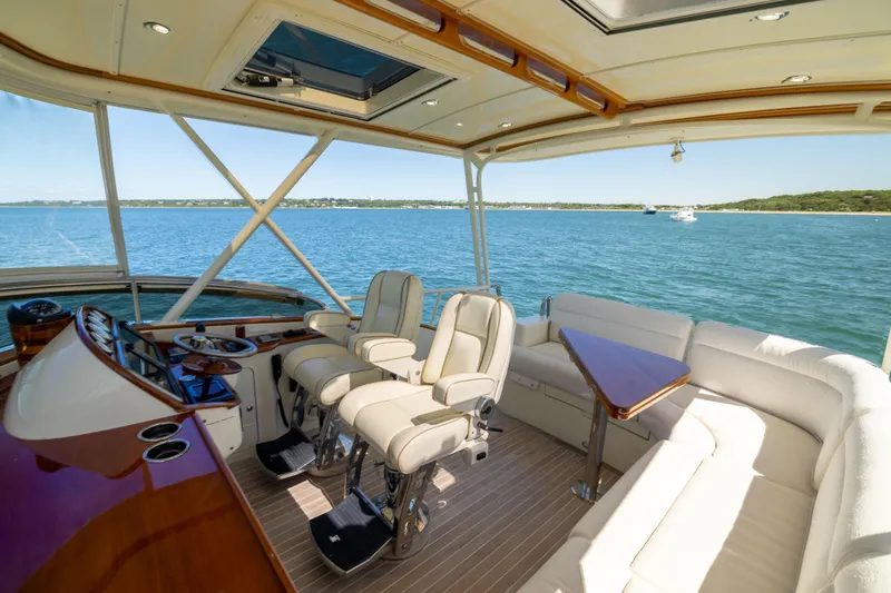 Slide: The Image of Luxurious interior of 2014 Hinckley Talaria 48 Flybridge yacht with scenic ocean view. - 58