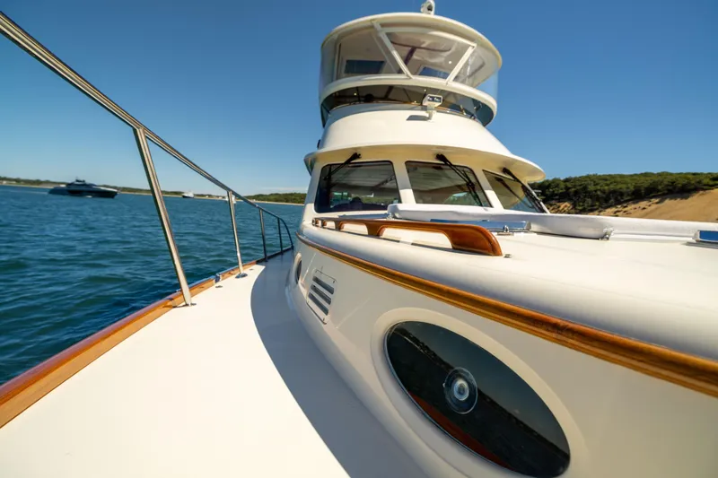 Slide: The Image of 2014 Hinckley Talaria 48 Flybridge yacht cruising on a sunny day. - 68