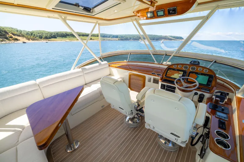 Slide: The Image of Luxurious 2014 Hinckley Talaria 48 Flybridge interior with scenic ocean view. - 51