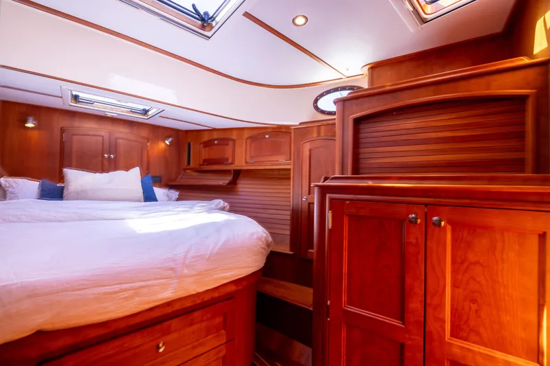 Slide: The Image of Luxurious wood-finished cabin interior of 2014 Hinckley Talaria 48 Flybridge yacht. - 42