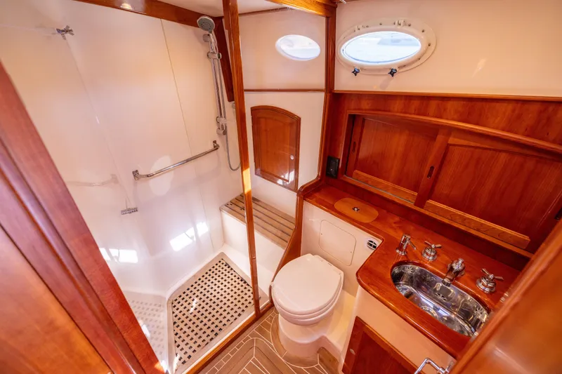 Slide: The Image of Luxurious 2014 Hinckley Talaria 48 Flybridge yacht bathroom with wood accents and modern fixtures. - 39