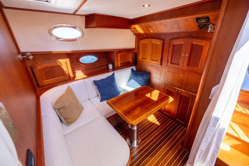 Slide: The Image of Luxurious 2014 Hinckley Talaria 48 Flybridge interior with elegant wood finish and cozy seating. - 38