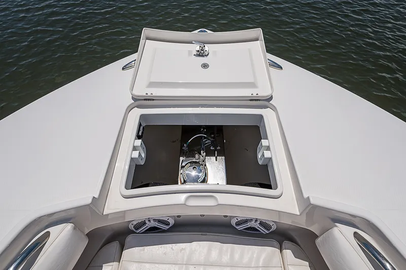 Slide: The Image of 2012 Regulator 28 Forward Seating boat with open storage compartment on deck. - 12