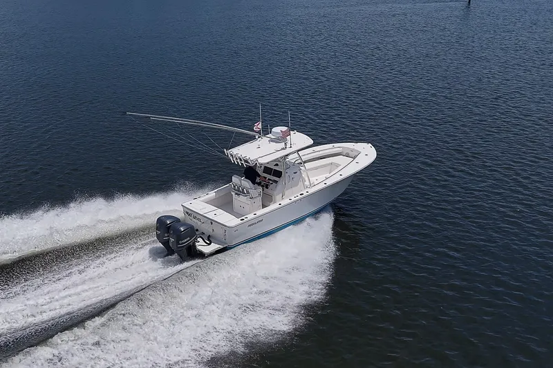 Slide: The Image of 2012 Regulator 28 Forward Seating boat cruising on open water. - 6
