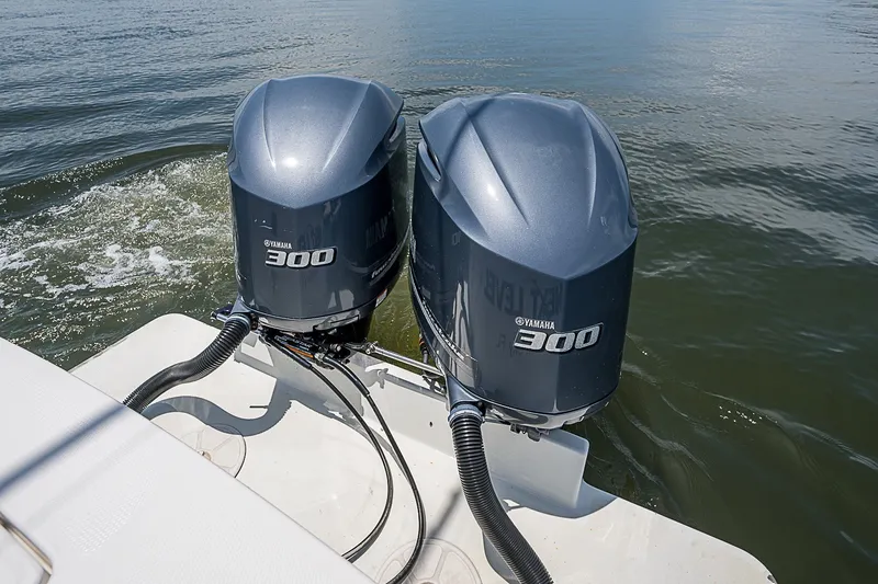 Slide: The Image of Twin Yamaha 300 engines on a 2012 Regulator 28 Forward Seating boat. - 23
