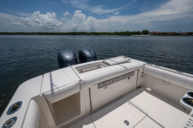 Slide: The Image of 2012 Regulator 28 Forward Seating boat with dual engines on calm water. - 20