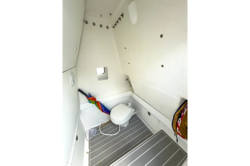 Slide: The Image of 2024 Cape Horn 34XS boat interior bathroom with toilet and compact design. - 22