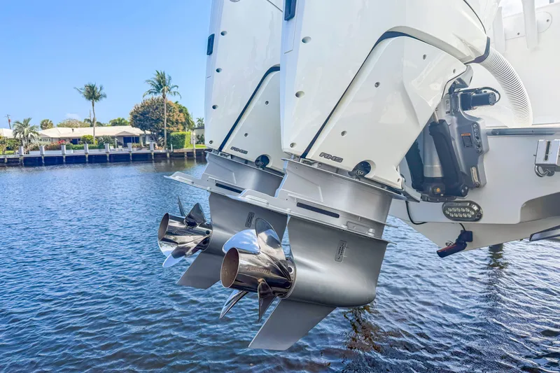 Slide: The Image of 2024 Cape Horn 34XS boat engines on water, showcasing dual outboard motors. - 21
