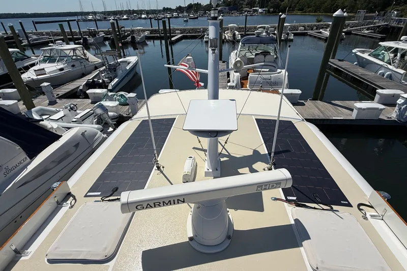 Slide: The Image of 2003 Grand Banks 49 Eastbay HX yacht docked at marina with Garmin radar. - 23