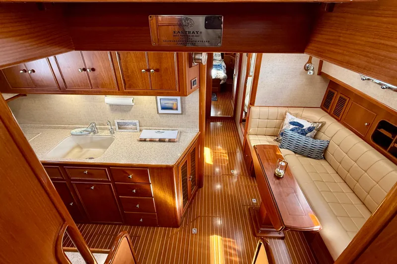 Slide: The Image of Luxurious interior of 2003 Grand Banks 49 Eastbay HX yacht with elegant wood finishes. - 48