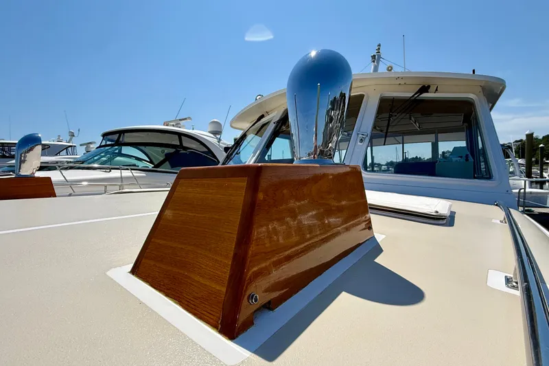 Slide: The Image of 2003 Grand Banks 49 Eastbay HX yacht with polished wood and chrome details. - 20