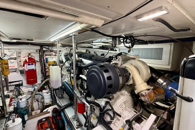 Slide: The Image of Engine room of 2003 Grand Banks 49 Eastbay HX yacht, featuring mechanical components and equipment. - 70