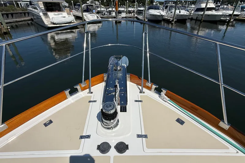 Slide: The Image of Bow view of 2003 Grand Banks 49 Eastbay HX yacht docked in marina. - 14