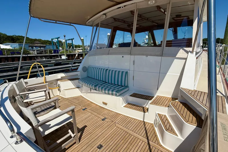 Slide: The Image of 2003 Grand Banks 49 Eastbay HX yacht with teak deck and striped seating. - 29