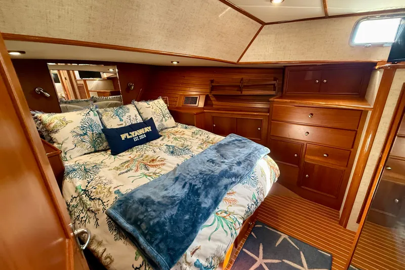 Slide: The Image of Luxurious cabin interior of 2003 Grand Banks 49 Eastbay HX with elegant wood finish. - 63