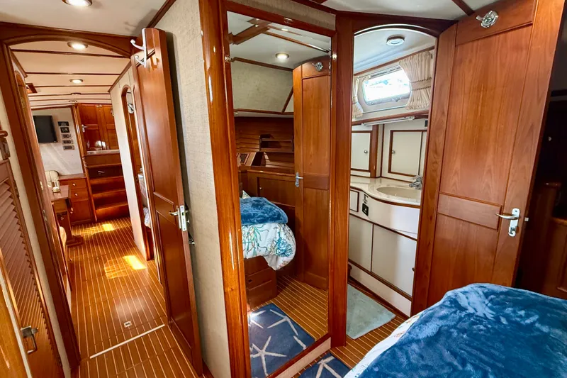 Slide: The Image of Luxurious 2003 Grand Banks 49 Eastbay HX yacht interior with wood finish and cozy cabin. - 66