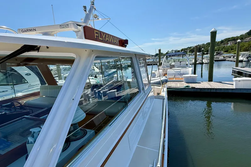 Slide: The Image of 2003 Grand Banks 49 Eastbay HX yacht docked at marina on sunny day. - 28