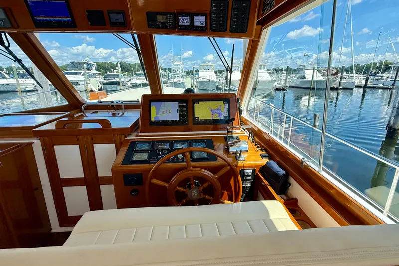 Slide: The Image of Interior helm of 2003 Grand Banks 49 Eastbay HX yacht, featuring navigation equipment. - 46