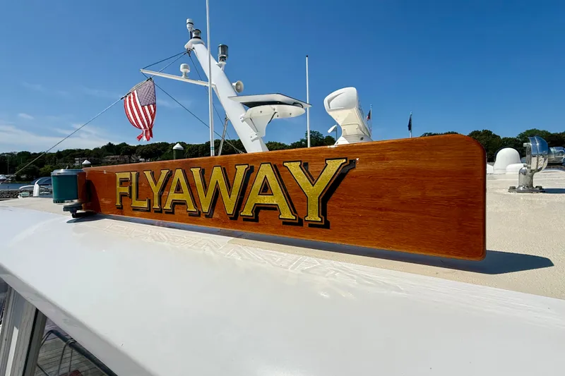 Slide: The Image of 2003 Grand Banks 49 Eastbay HX yacht with "FLYAWAY" nameplate and American flag. - 25