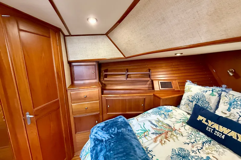Slide: The Image of Luxurious cabin interior of 2003 Grand Banks 49 Eastbay HX yacht with wood finish. - 65