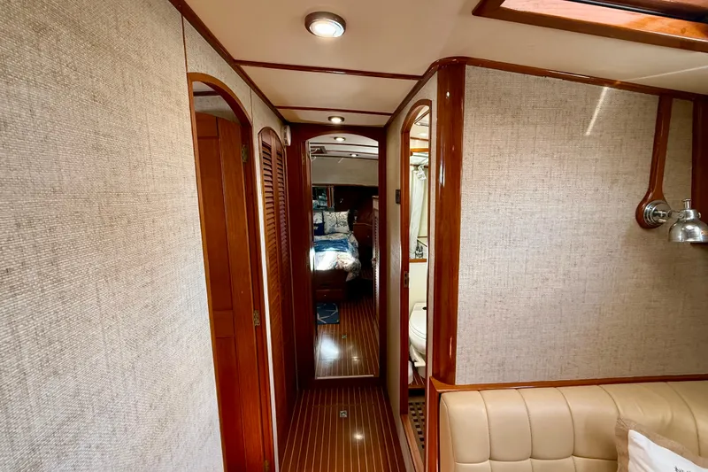 Slide: The Image of Luxurious interior of 2003 Grand Banks 49 Eastbay HX yacht with wood accents and cozy cabin. - 55