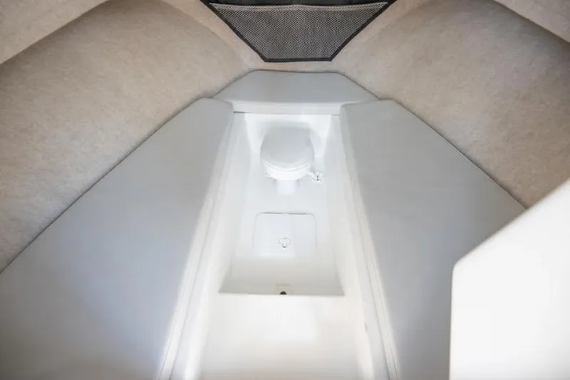 Slide: The Image of Manufacturer Provided Image: Interior cabin of 2025 Parker 2520 XLD Sport Cabin boat with a compact toilet. - 7
