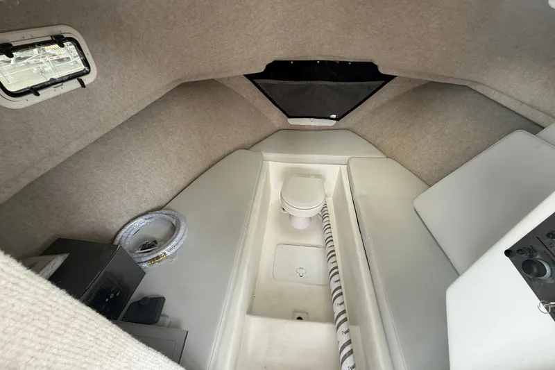 Slide: The Image of 2025 Parker 2520 XLD Sport Cabin interior with compact toilet and storage. - 8