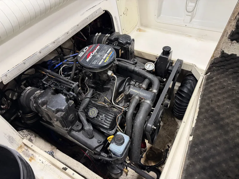 Slide: The Image of The 1999 Sport-Craft Sportsman features a well-maintained engine compartment with a 5.0 MPI MerCruiser engine. - 15