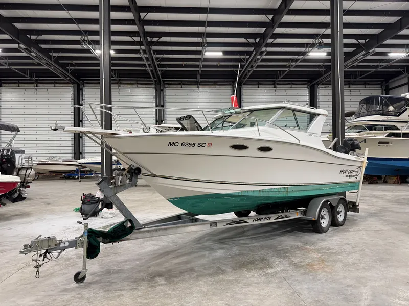 Slide: The Image of A 1999 Sport-Craft Sportsman boat on a trailer in a storage facility. - 4