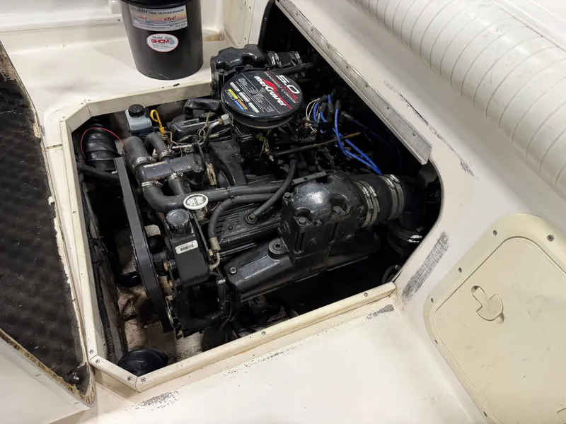 Slide: The Image of The 1999 Sport-Craft Sportsman features an open engine compartment with a well-maintained engine. - 14