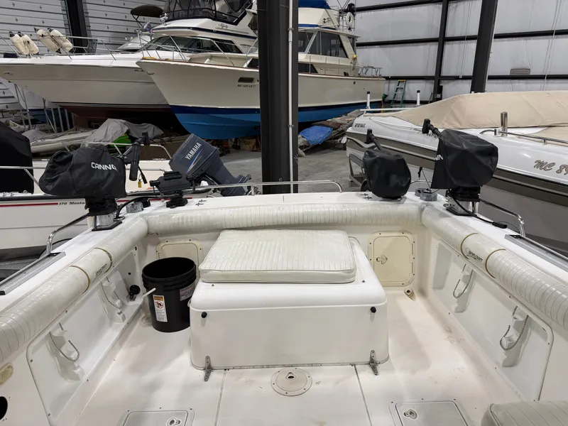 Slide: The Image of The image shows the cockpit of a 1999 Sport-Craft Sportsman in a storage facility. - 5