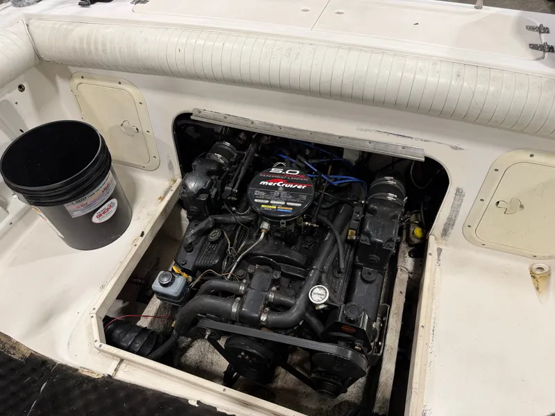 Slide: The Image of The 1999 Sport-Craft Sportsman features an open engine compartment with a 5.0-liter MerCruiser engine. - 13