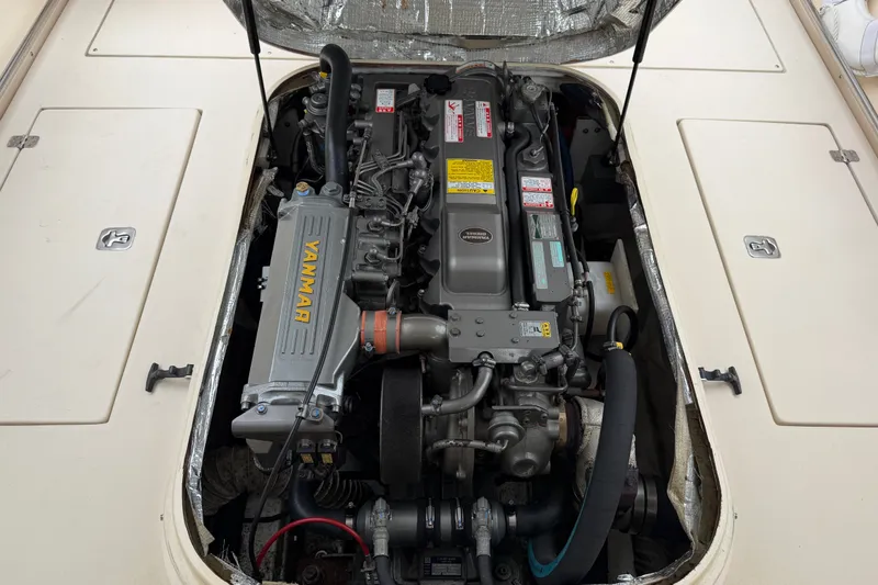 Slide: The Image of Engine compartment of a 2006 Albin 28 Gatsby Edition with Yanmar engine visible. - 49