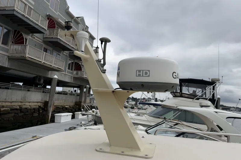 Slide: The Image of Radar equipment on a 2006 Albin 28 Gatsby Edition boat docked at a marina. - 65
