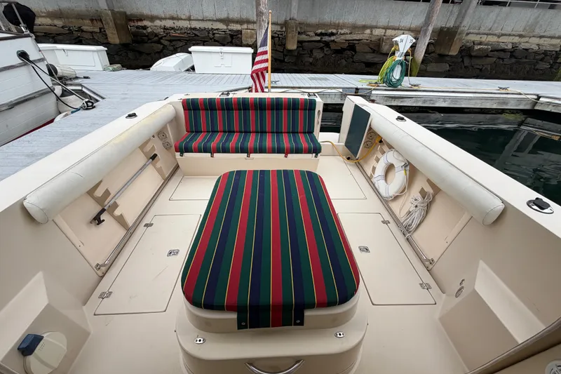 Slide: The Image of 2006 Albin 28 Gatsby Edition boat interior with striped seating at dock. - 20