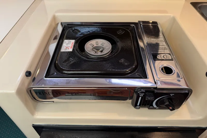 Slide: The Image of Built-in stove on 2006 Albin 28 Gatsby Edition boat, featuring a Princess burner. - 42