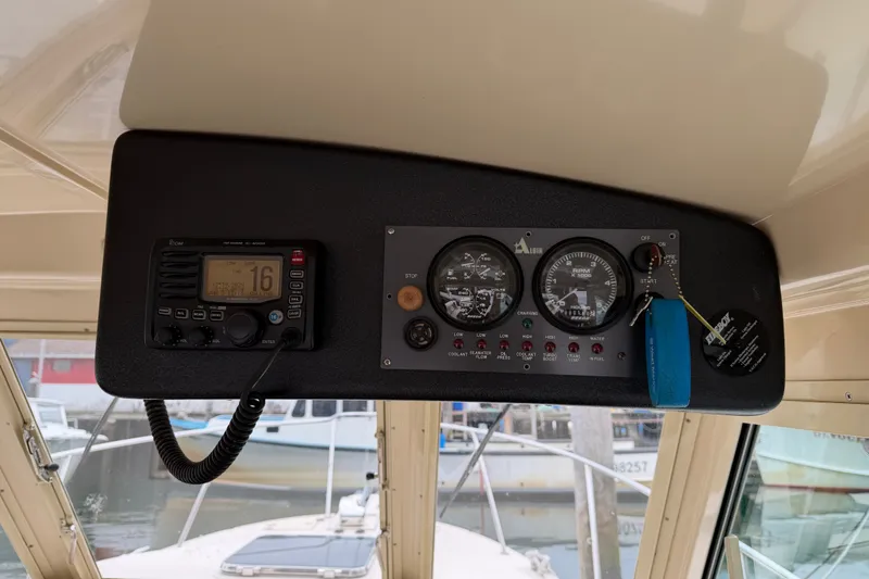 Slide: The Image of Control panel of a 2006 Albin 28 Gatsby Edition boat with gauges and radio. - 27