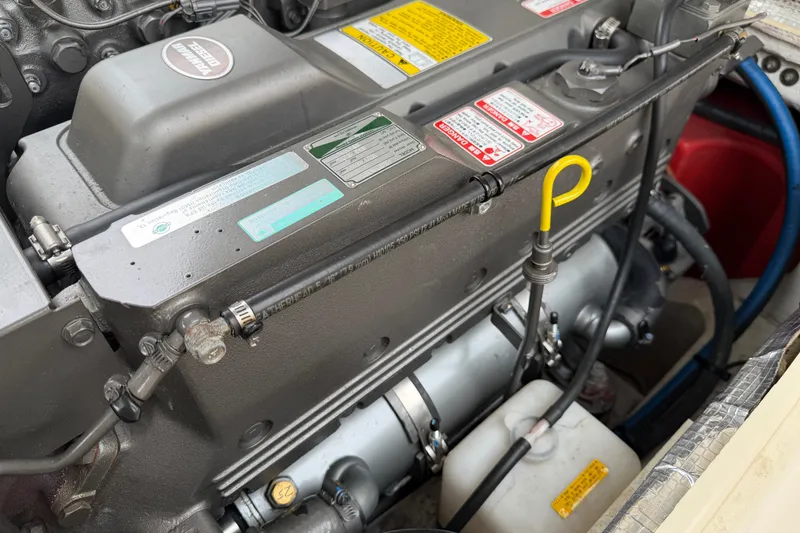 Slide: The Image of Engine compartment of a 2006 Albin 28 Gatsby Edition boat, showcasing detailed components. - 56