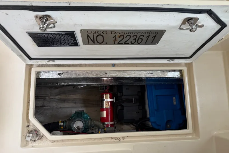 Slide: The Image of Storage compartment of 2006 Albin 28 Gatsby Edition with USCG documentation number. - 48