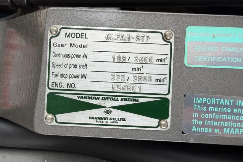 Slide: The Image of Yanmar diesel engine plate on 2006 Albin 28 Gatsby Edition, model 6LPAM-STP. - 54