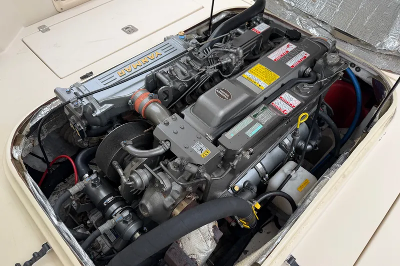 Slide: The Image of Engine compartment of a 2006 Albin 28 Gatsby Edition boat, featuring a Yanmar engine. - 51