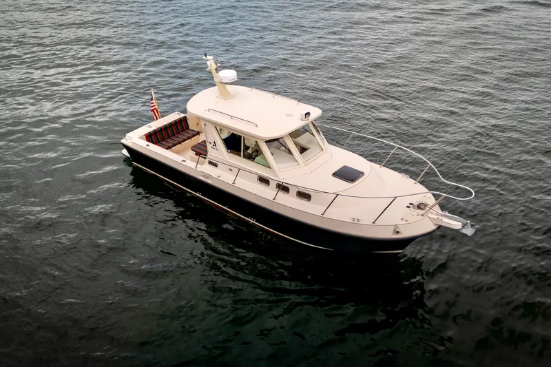 Slide: The Image of 2006 Albin 28 Gatsby Edition boat on calm water, aerial view. - 13