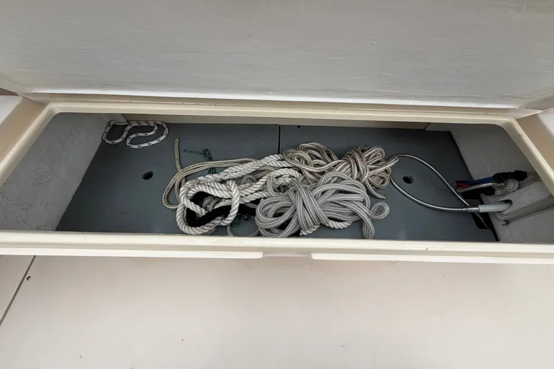 Slide: The Image of Storage compartment with ropes on a 2006 Albin 28 Gatsby Edition boat. - 61
