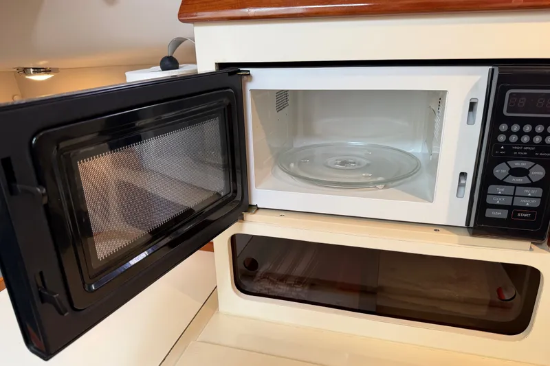Slide: The Image of Open microwave in 2006 Albin 28 Gatsby Edition boat interior. - 44