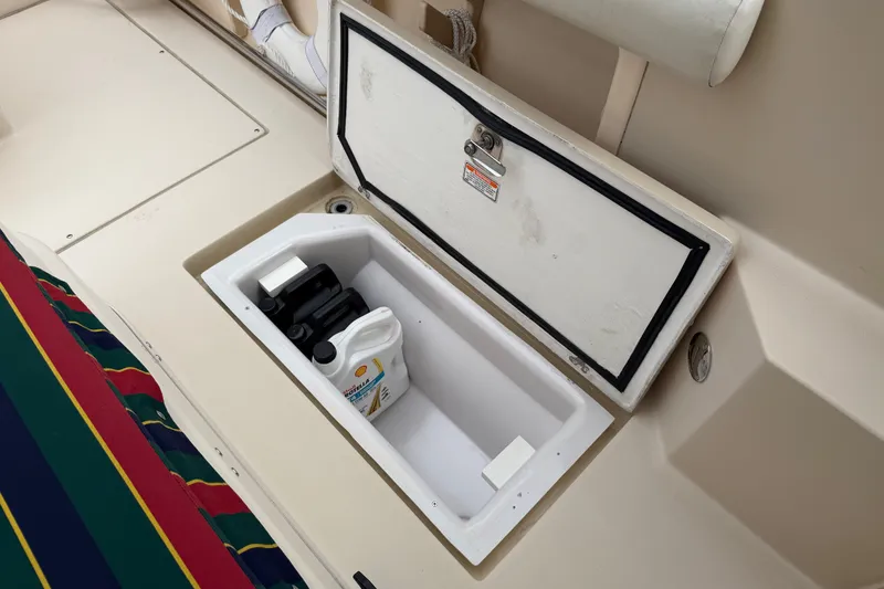 Slide: The Image of Storage compartment on 2006 Albin 28 Gatsby Edition boat with maintenance supplies. - 59