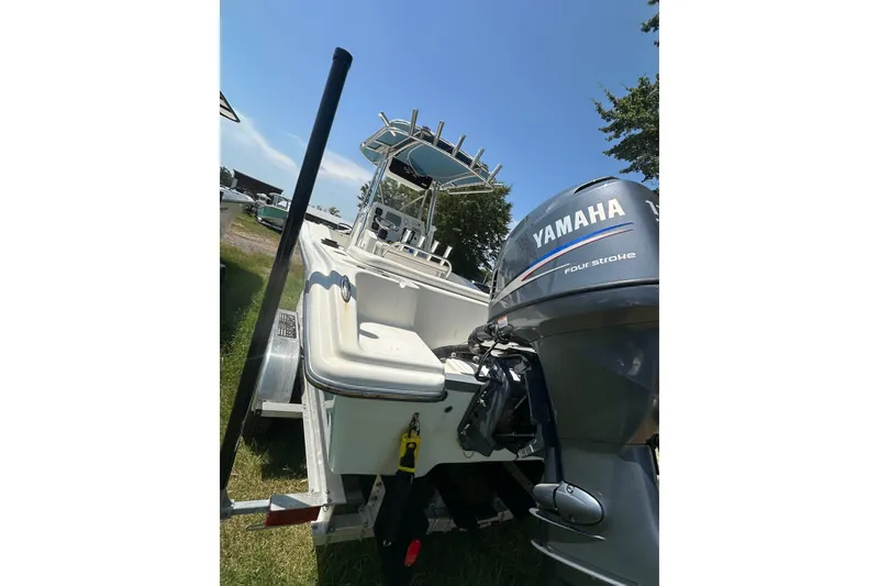 Slide: The Image of 2012 Sundance NX25 boat with Yamaha four-stroke engine on trailer. - 17