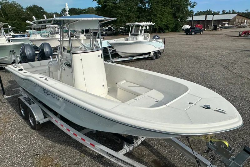 The Image of 2012 Sundance NX25 boat on trailer in outdoor lot. - 0